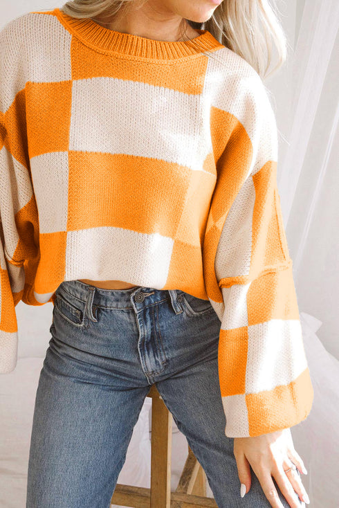 Pull à carreaux avec manches tendance : le style dans les détails