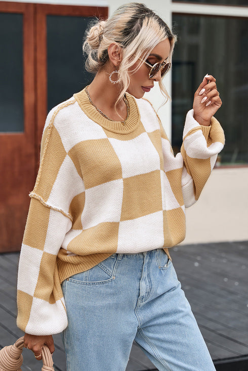 Pull à carreaux avec manches tendance : le style dans les détails