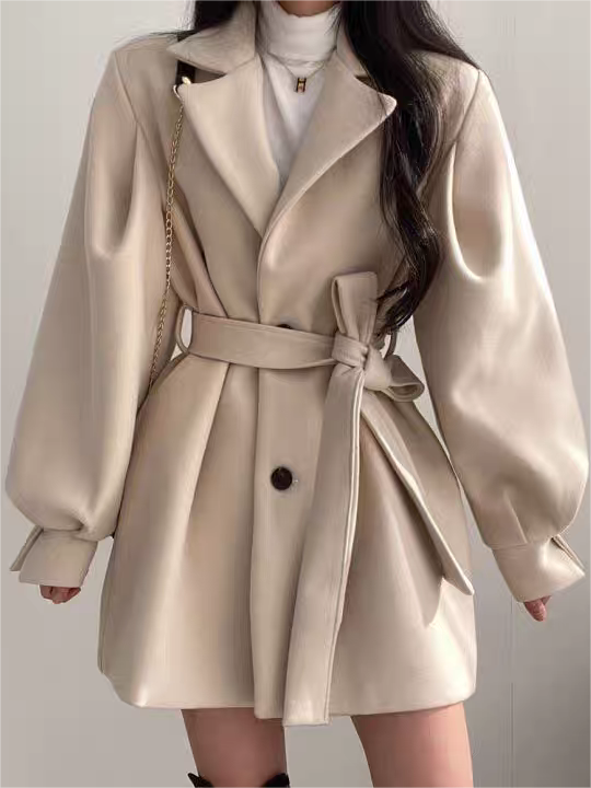 Manteau femme avec col à revers, manches bouffantes et ceinture élégante